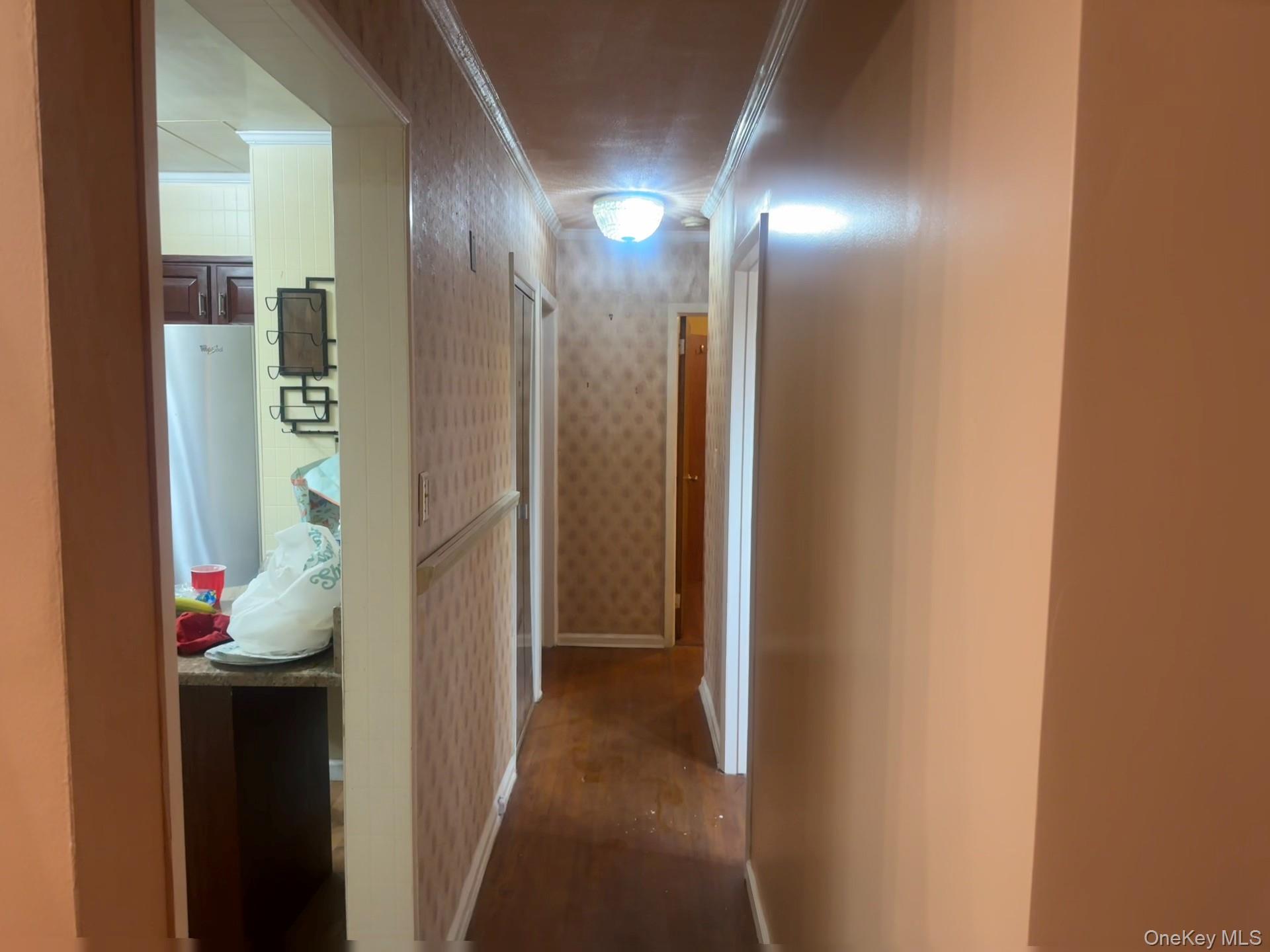 109-11 225th Street, Unit 1 Queens, NY 11429 - Photo 9 of 10 a view of a hallway with painted walls