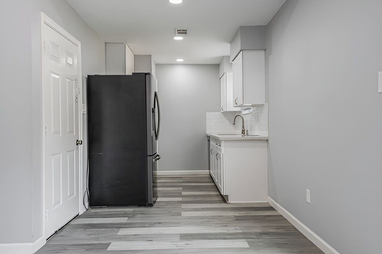 415 Bellmar Lane Friendswood, TX 77546 - Photo 14 of 34 a view of a kitchen with refrigerator and cabinet