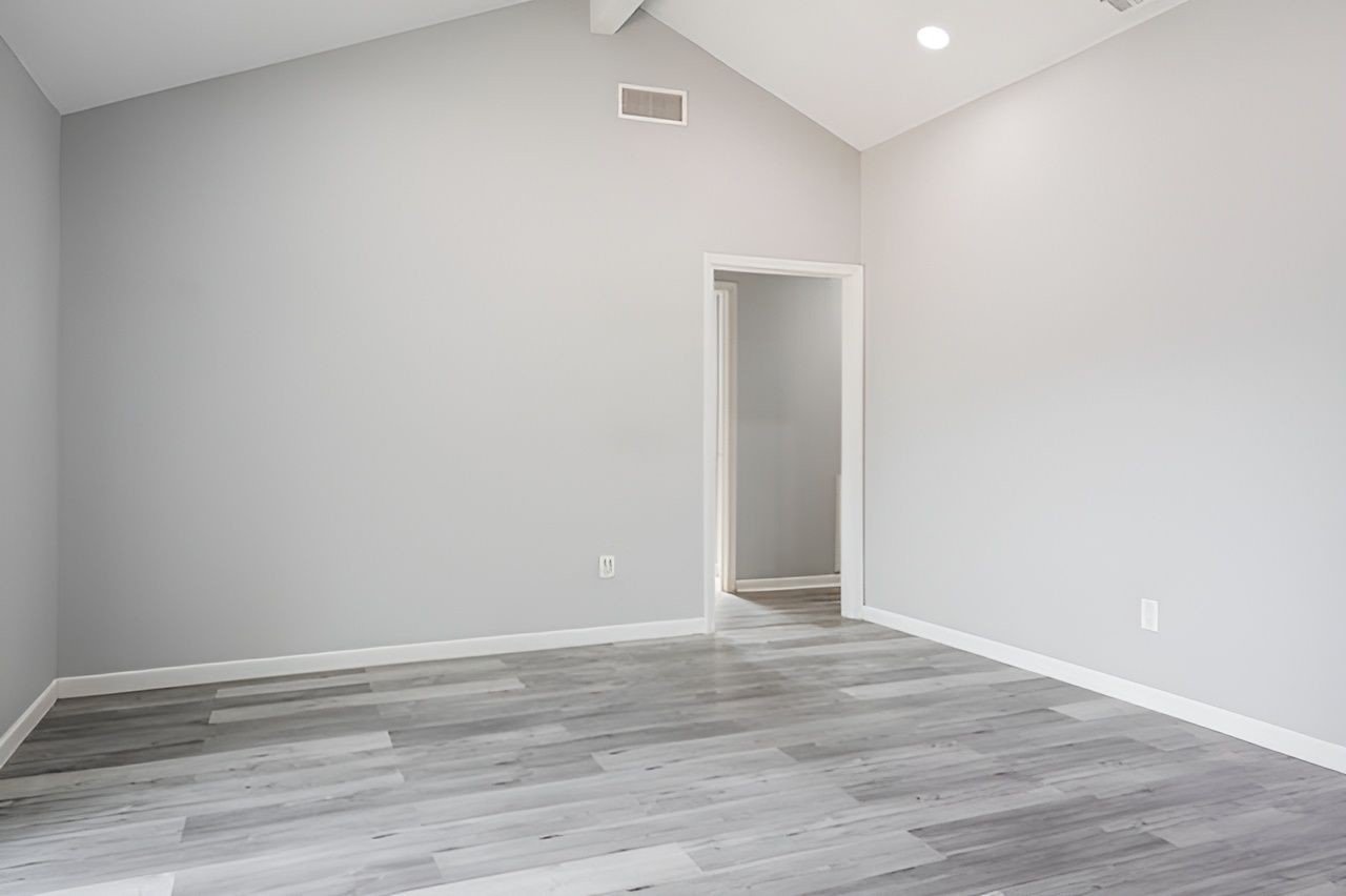 415 Bellmar Lane Friendswood, TX 77546 - Photo 17 of 34 a view of an empty room with wooden floor