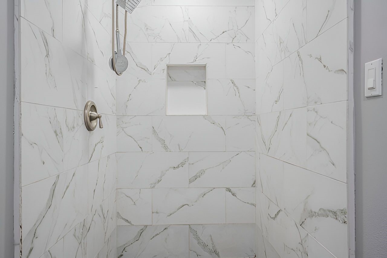 415 Bellmar Lane Friendswood, TX 77546 - Photo 20 of 34 a bathroom with a shower