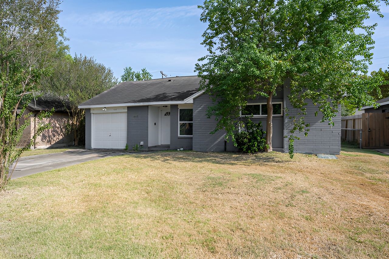 415 Bellmar Lane Friendswood, TX 77546 - Photo 2 of 34 a house with trees in front of it