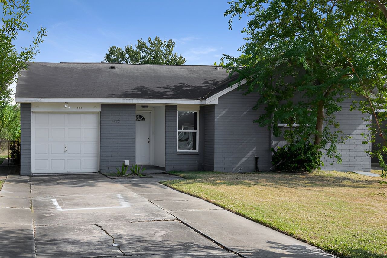 415 Bellmar Lane Friendswood, TX 77546 - Photo 5 of 34 a house with a tree in front of it