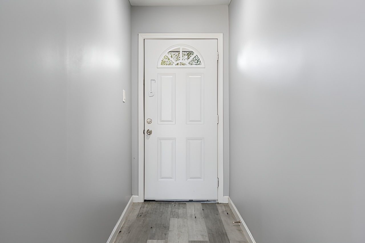 415 Bellmar Lane Friendswood, TX 77546 - Photo 6 of 34 a view of hallway with wooden floor
