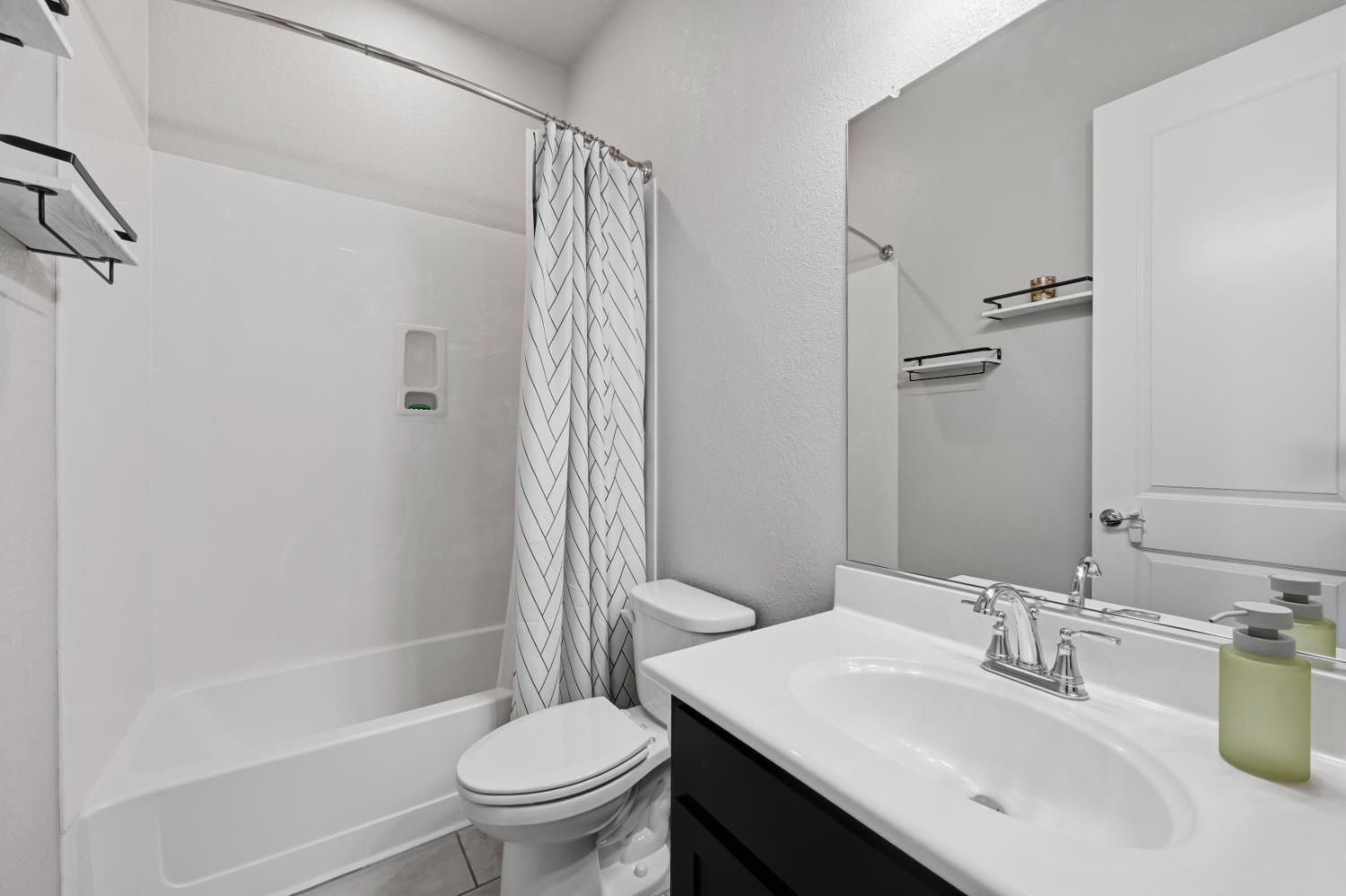 2012 Van Ruiten Drive Lodi, CA 95242 - Photo 25 of 48 a bathroom with a sink toilet and shower