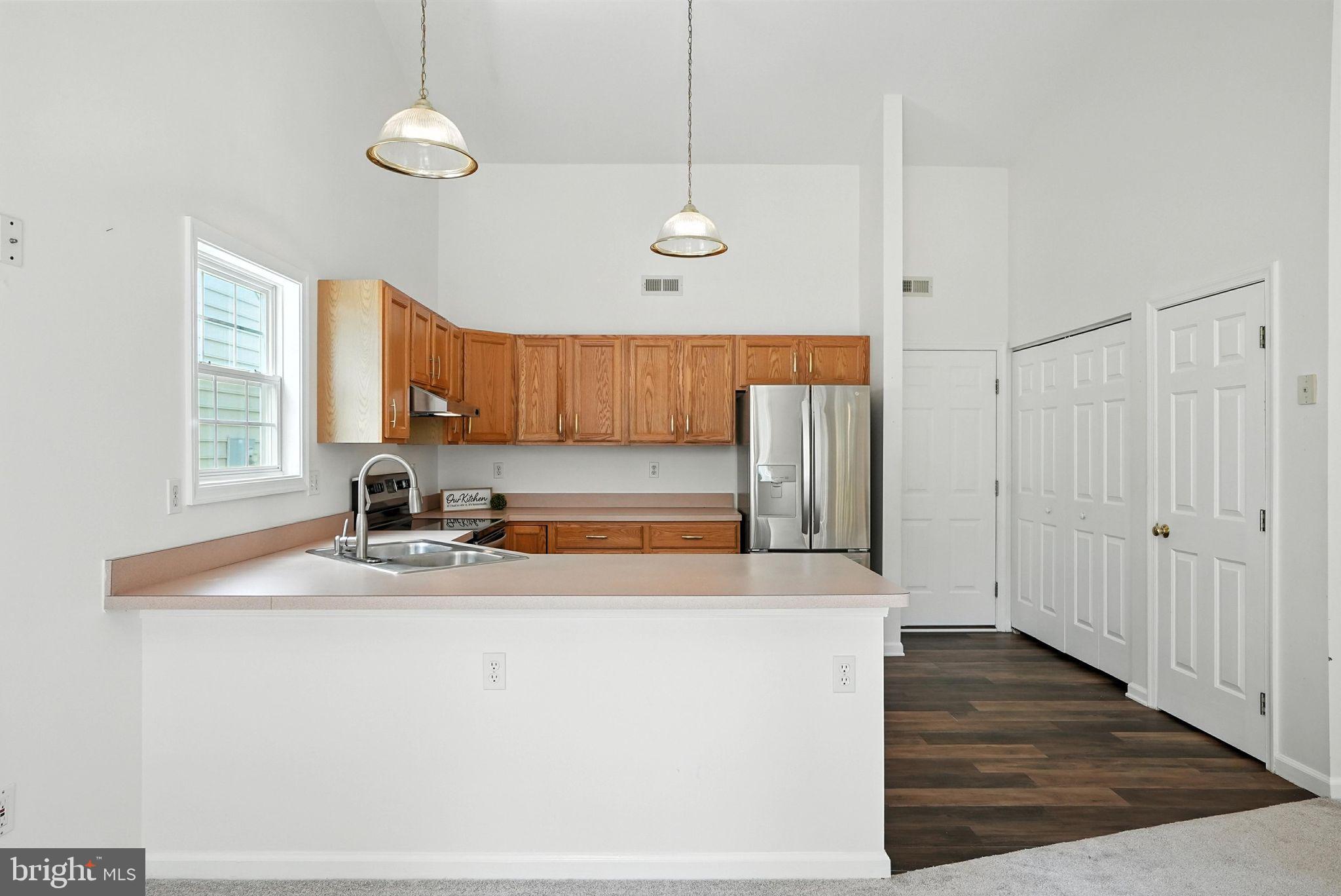 808 Ripplebrook Drive Culpeper, VA 22701 - Photo 17 of 48 a view of a kitchen with wooden floor and a sink