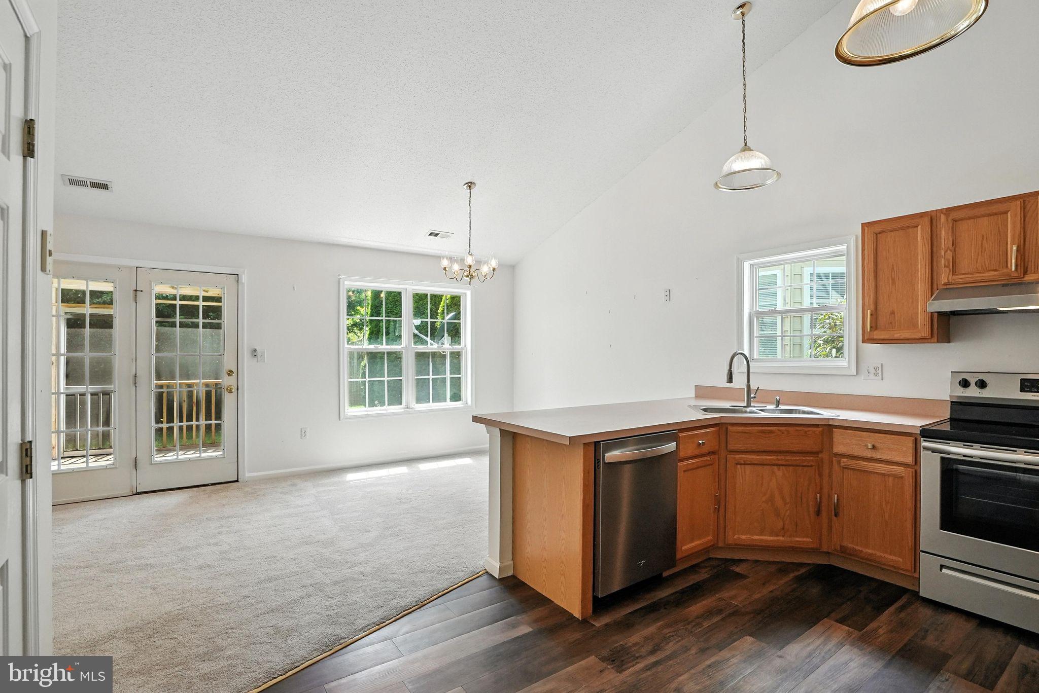 808 Ripplebrook Drive Culpeper, VA 22701 - Photo 20 of 48 a kitchen with stainless steel appliances granite countertop a sink a stove and a window