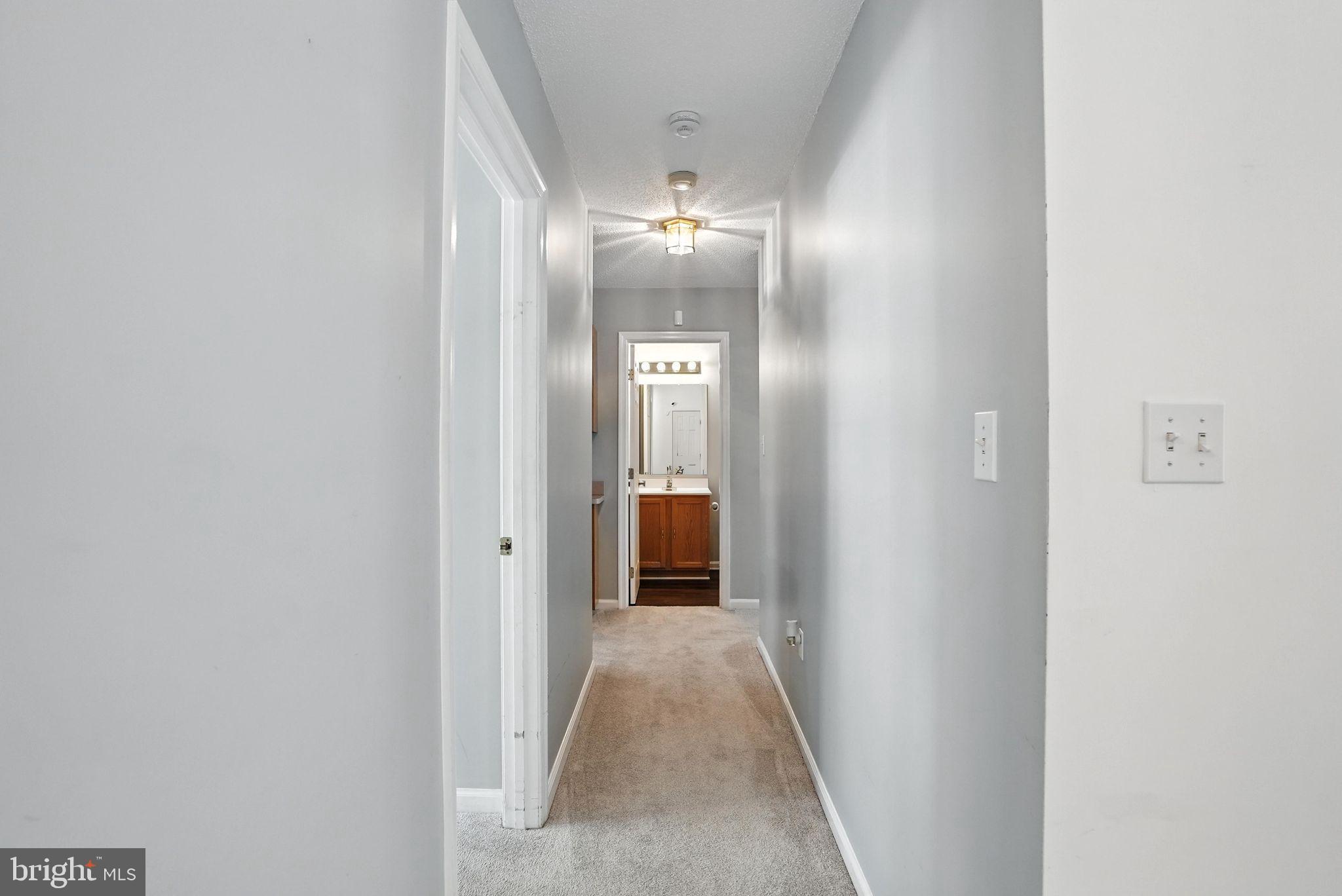 808 Ripplebrook Drive Culpeper, VA 22701 - Photo 22 of 48 a view of a hallway with wooden floor