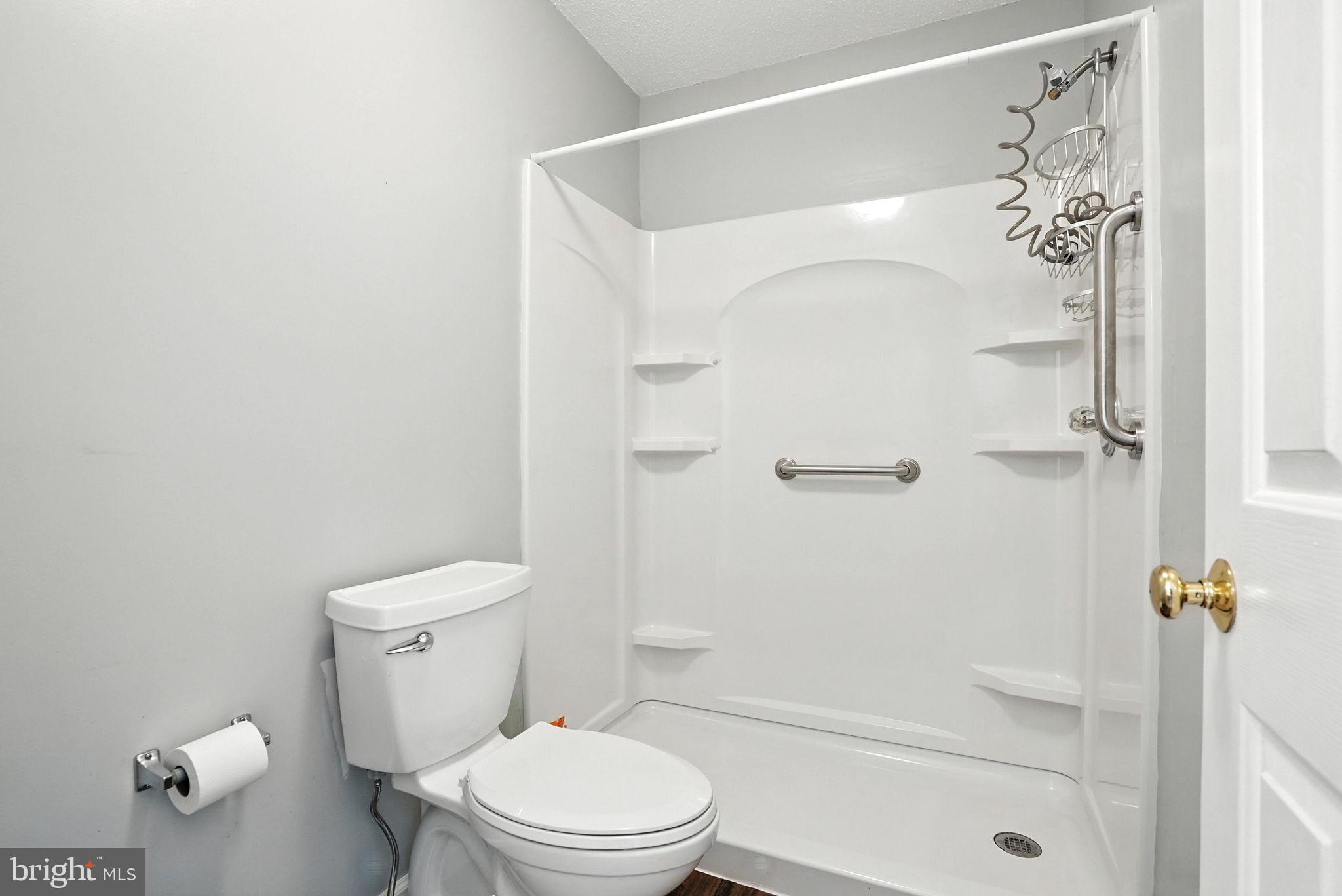 808 Ripplebrook Drive Culpeper, VA 22701 - Photo 28 of 48 a white toilet sitting next to a bath tub