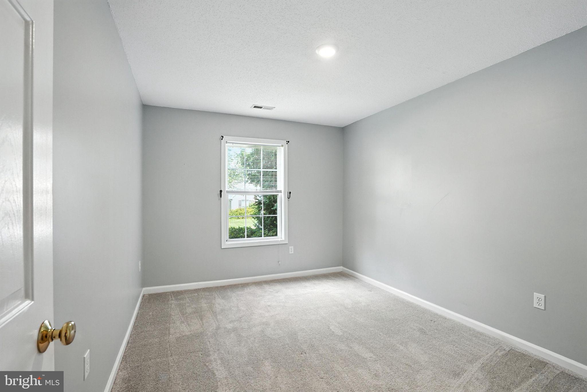 808 Ripplebrook Drive Culpeper, VA 22701 - Photo 31 of 48 an empty room with windows