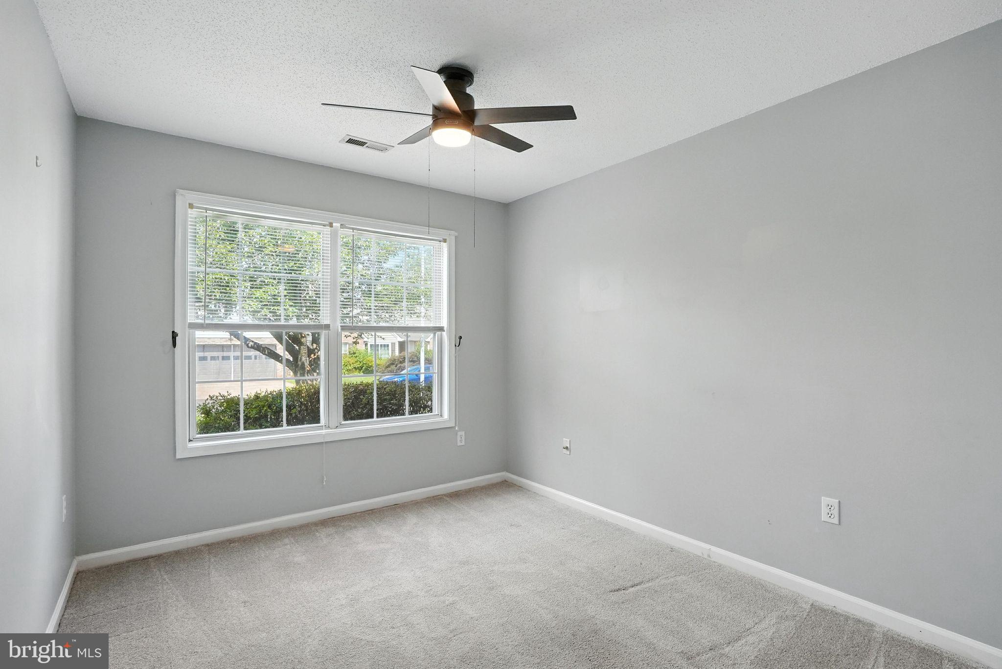 808 Ripplebrook Drive Culpeper, VA 22701 - Photo 33 of 48 an empty room with a window and a ceiling fan