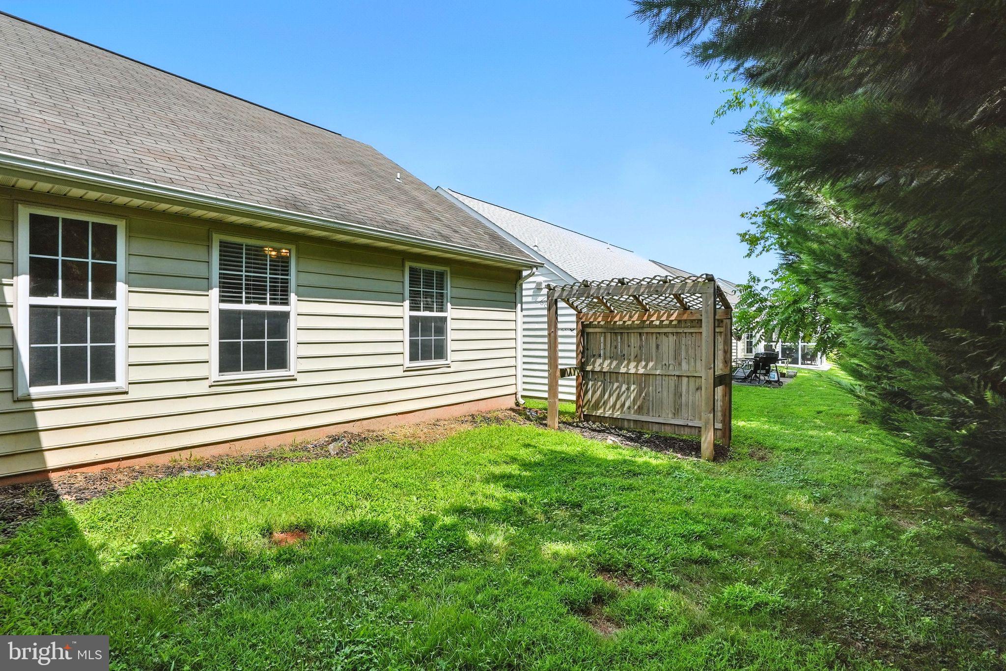 808 Ripplebrook Drive Culpeper, VA 22701 - Photo 44 of 48 a front view of a house with a garden
