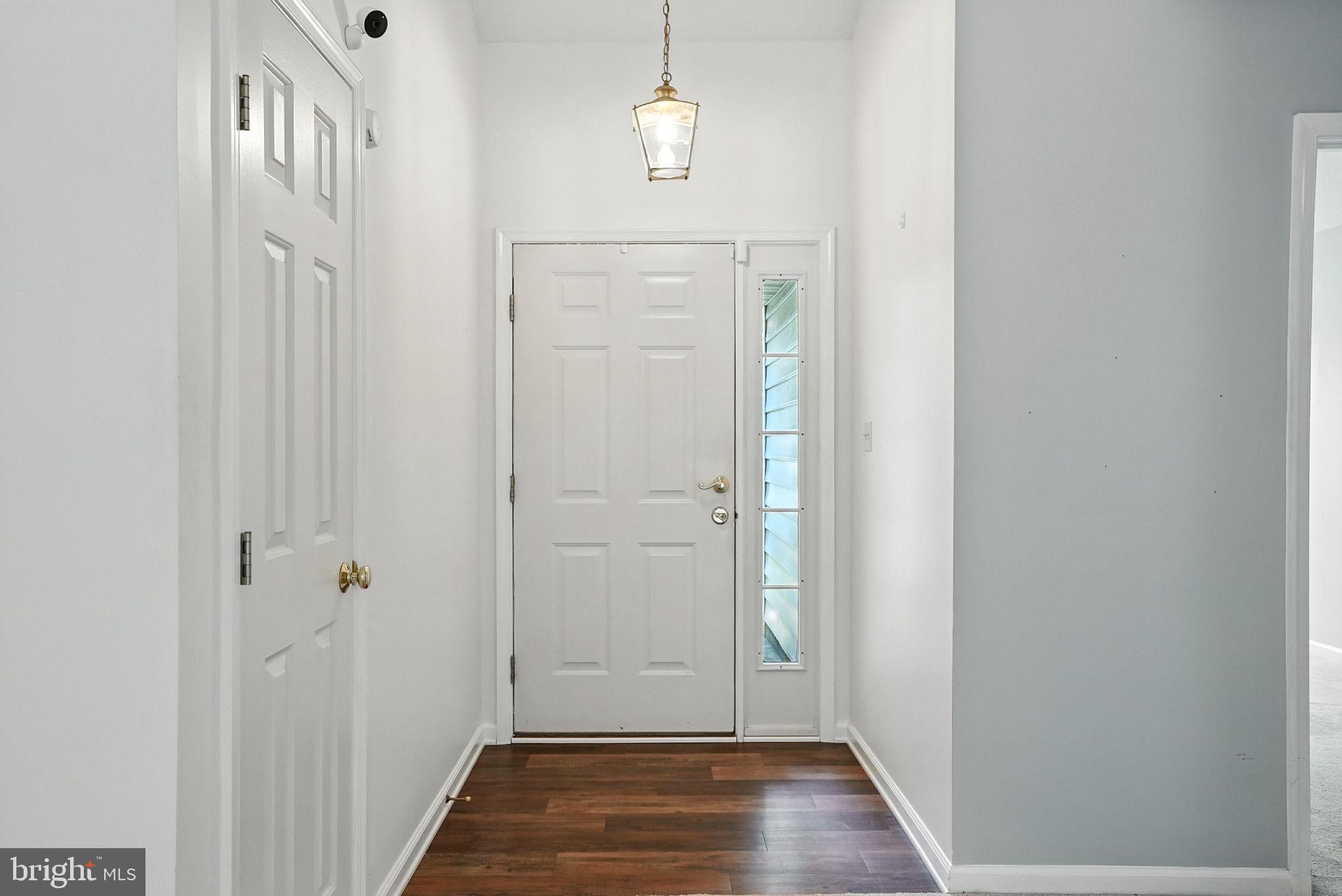 808 Ripplebrook Drive Culpeper, VA 22701 - Photo 9 of 48 a view of a hallway with wooden floor