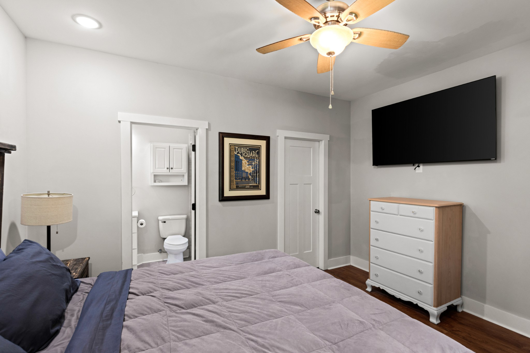 115 North Adams Street Adams, TN 37010 - Photo 24 of 44 a bedroom with a bed and a flat screen tv