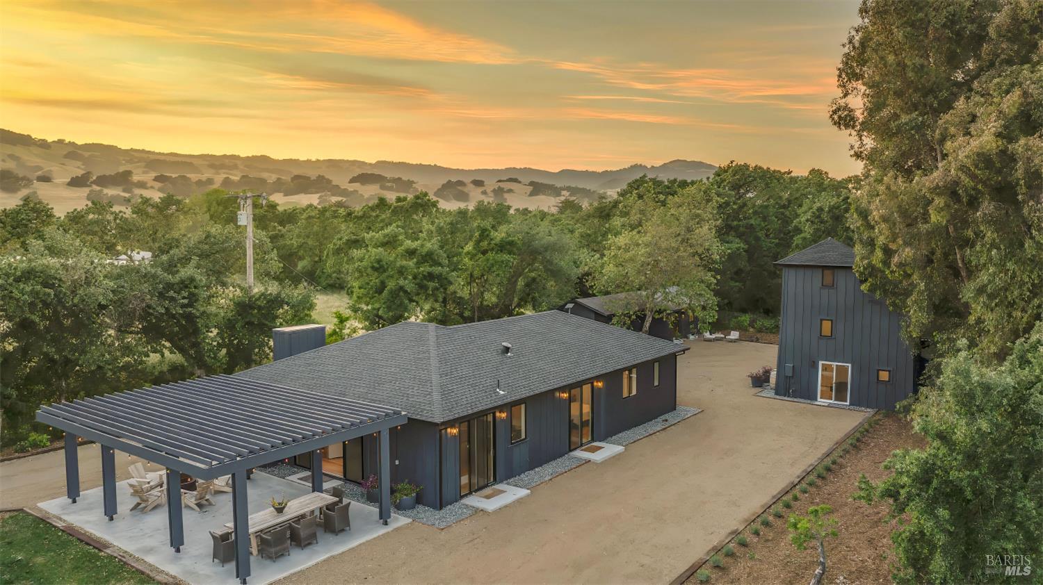 a roof deck with the table and chairs