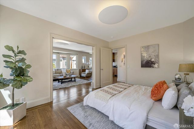 a bedroom with a bed and glass window