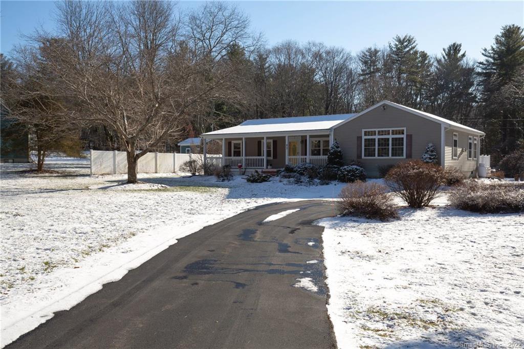 83 Thompson Hill Road Thompson, CT 06255 - Photo 1 of 1 a front view of a house with a yard covered in snow
