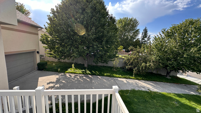 3547 East Golden Eagle Road Eagle Mountain, UT 84005 - Photo 45 of 47 View of yard with concrete driveway and a balcony