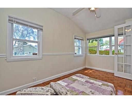 123 Hardy Pond Road Waltham, MA 02451 - Photo 17 of 30 a view of an empty room with wooden floor and a window