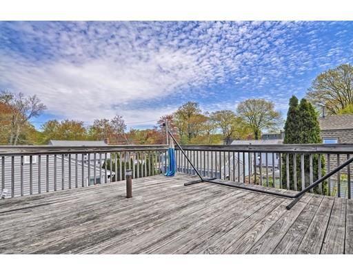 123 Hardy Pond Road Waltham, MA 02451 - Photo 26 of 30 a view of balcony with wooden floor and fence