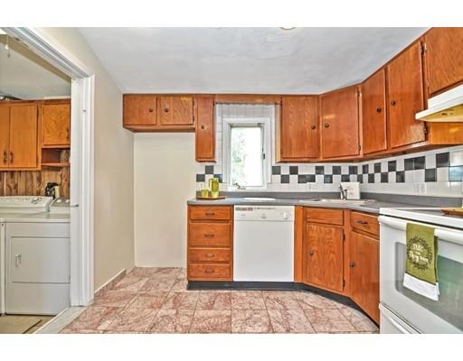 123 Hardy Pond Road Waltham, MA 02451 - Photo 8 of 30 a kitchen with stainless steel appliances granite countertop a stove a sink and a microwave