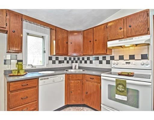 123 Hardy Pond Road Waltham, MA 02451 - Photo 9 of 30 a kitchen with granite countertop a sink stainless steel appliances and cabinets