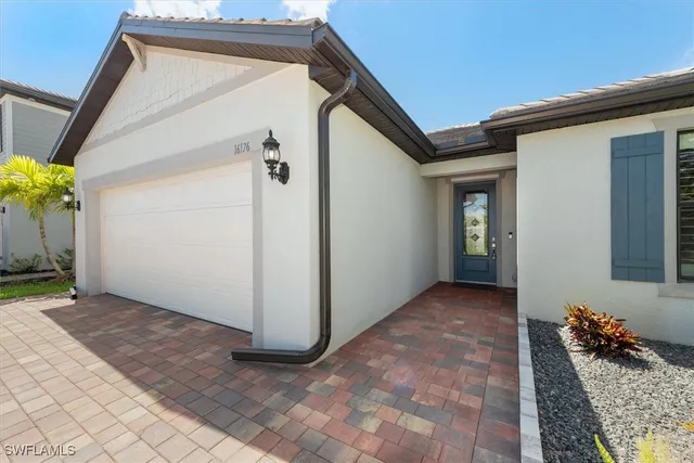 a view of a house with wooden floor and a potted plant
