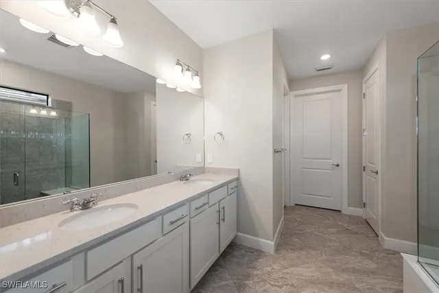 a bathroom with a shower and a sink