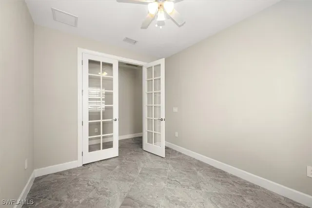 a living room with furniture and a lamp