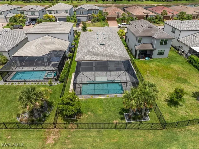 a view of a lake with houses in the back