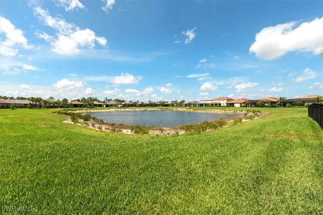 a front view of house with a garden