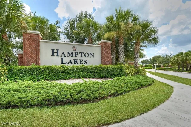 an aerial view of a swimming pool patio and lake view
