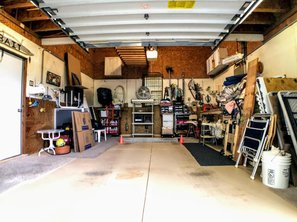 253 Riverwood Road Naples, FL 34114 - Photo 17 of 18 a view of a storage room with a lot of stuff