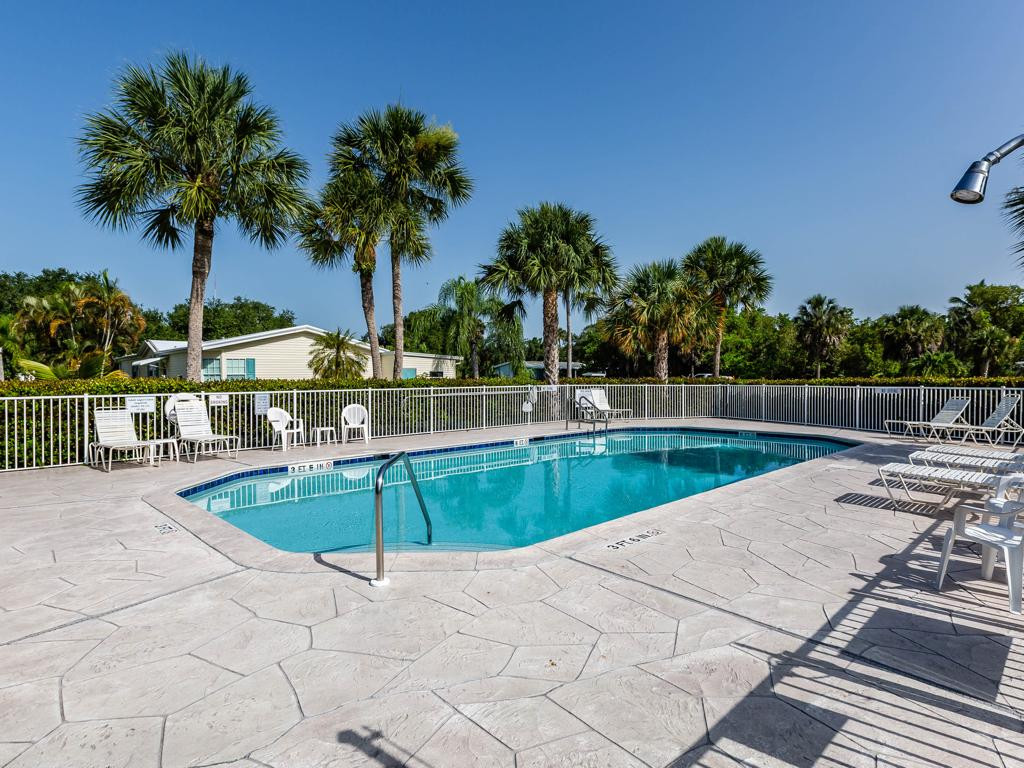 253 Riverwood Road Naples, FL 34114 - Photo 3 of 18 a view of swimming pool with a yard