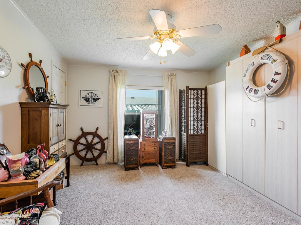 253 Riverwood Road Naples, FL 34114 - Photo 7 of 18 a view of a room with gym equipment