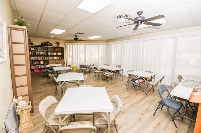 a living room with lots of furniture and a large window