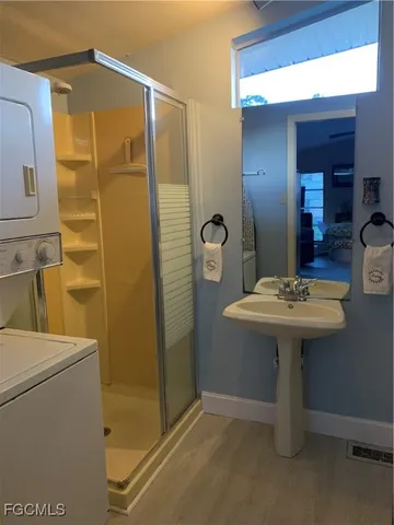 a bathroom with a sink mirror and toilet