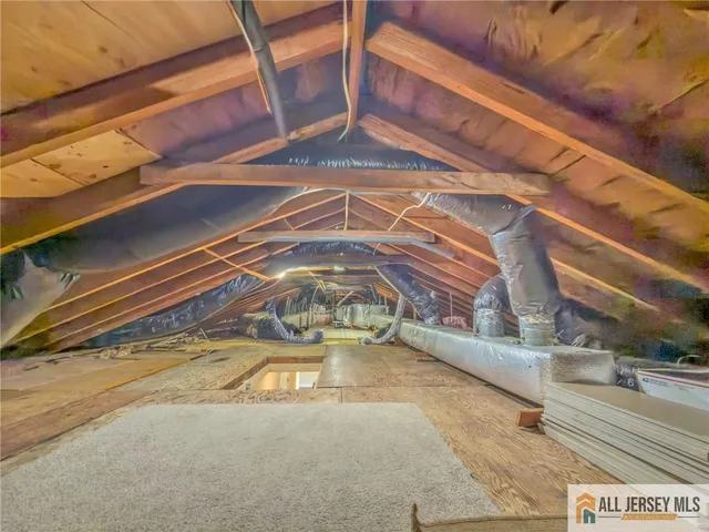 a view of a big house with a big yard and large trees