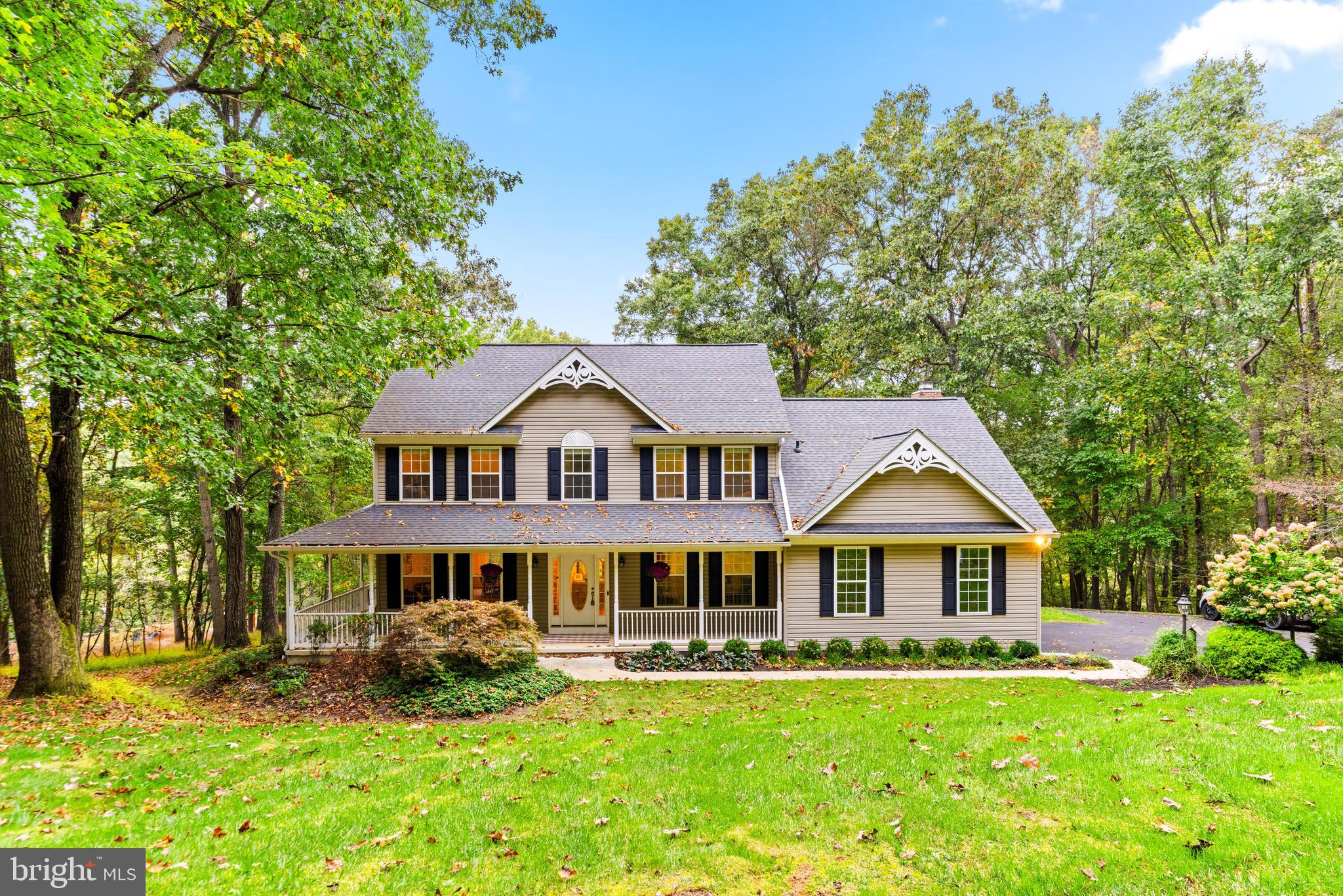 a front view of a house with yard