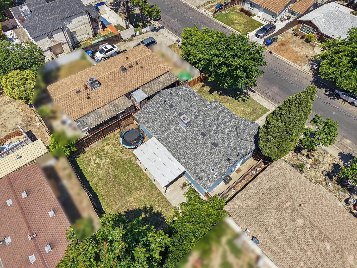 152 Drake Avenue Modesto, CA 95350 - Photo 39 of 52 an aerial view of a house with a yard and wooden fence