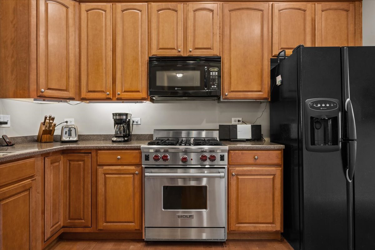 2866 Bond Circle Naperville, IL 60563 - Photo 11 of 28 a kitchen with stainless steel appliances granite countertop a refrigerator and a stove top oven