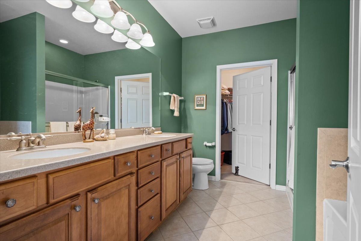 2866 Bond Circle Naperville, IL 60563 - Photo 15 of 28 a spacious bathroom with a double vanity sink and a mirror