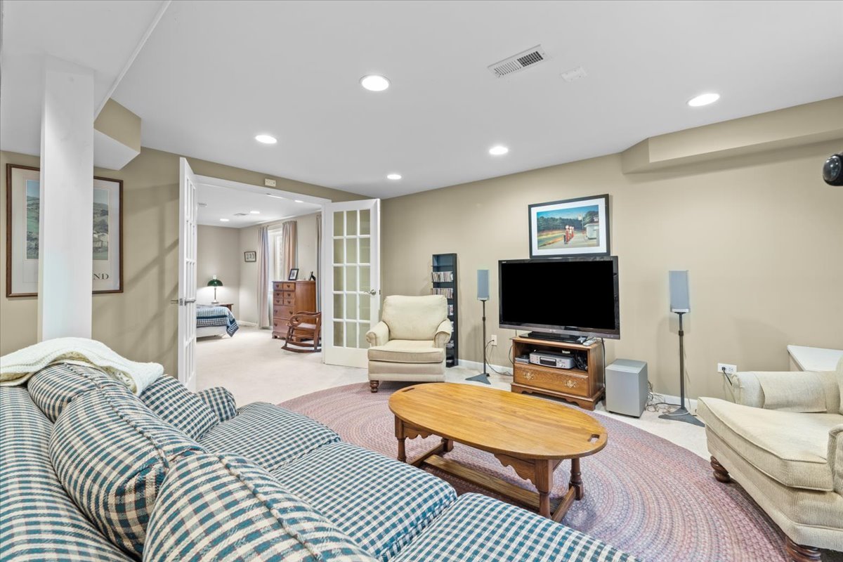 2866 Bond Circle Naperville, IL 60563 - Photo 20 of 28 a living room with furniture and a flat screen tv