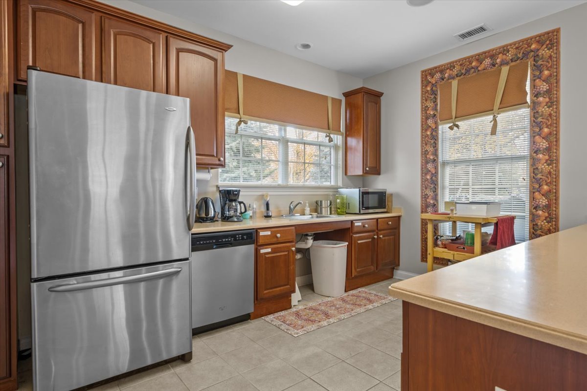 2866 Bond Circle Naperville, IL 60563 - Photo 25 of 28 a kitchen with stainless steel appliances granite countertop a refrigerator a sink a stove and a refrigerator