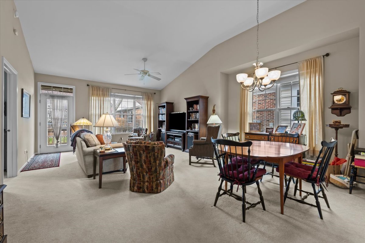 2866 Bond Circle Naperville, IL 60563 - Photo 5 of 28 a dining room with furniture a livingroom and chandelier