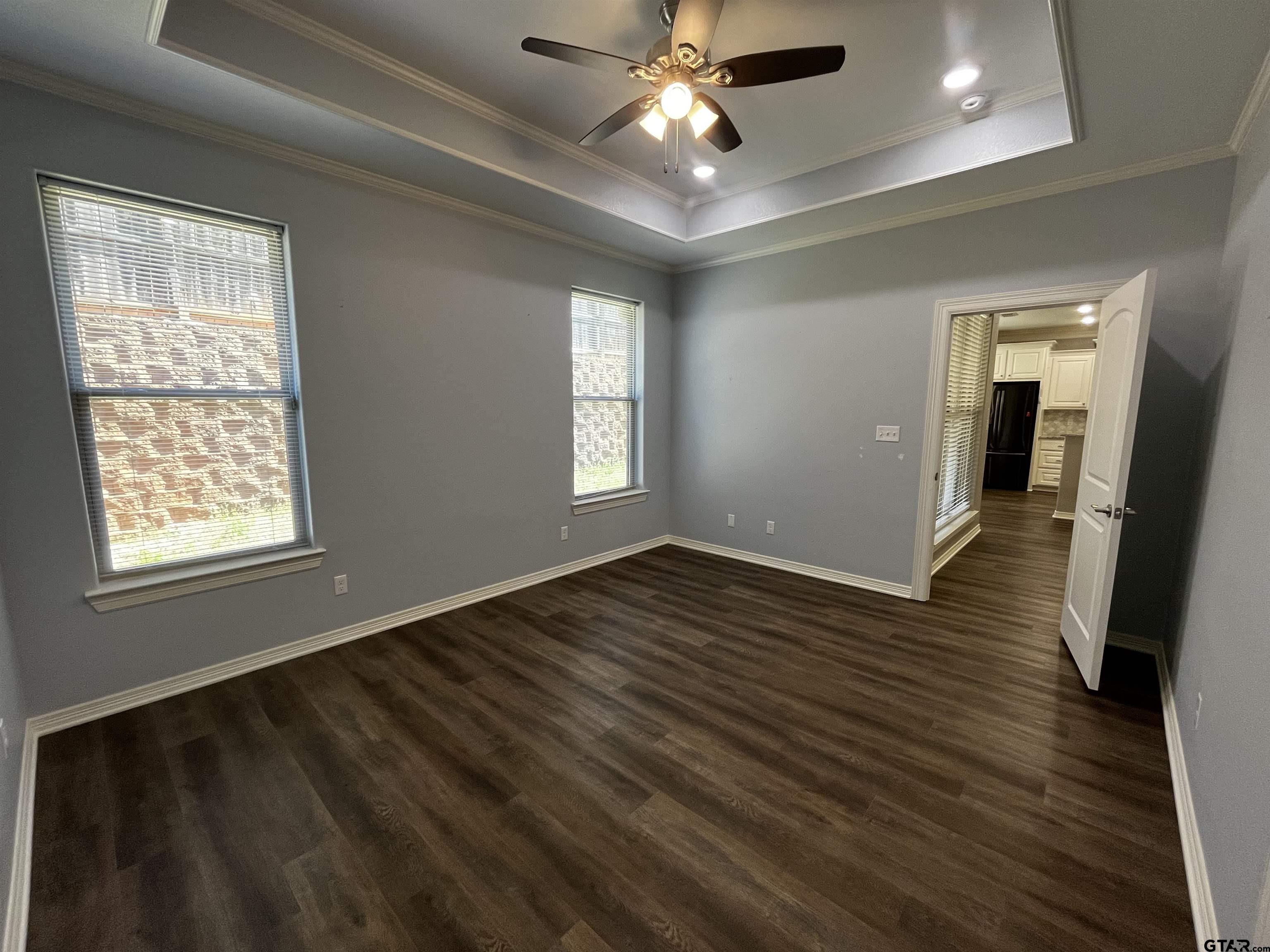 136 Letha Court Tyler, TX 75702 - Photo 11 of 34 a view of an empty room with wooden floor and a window