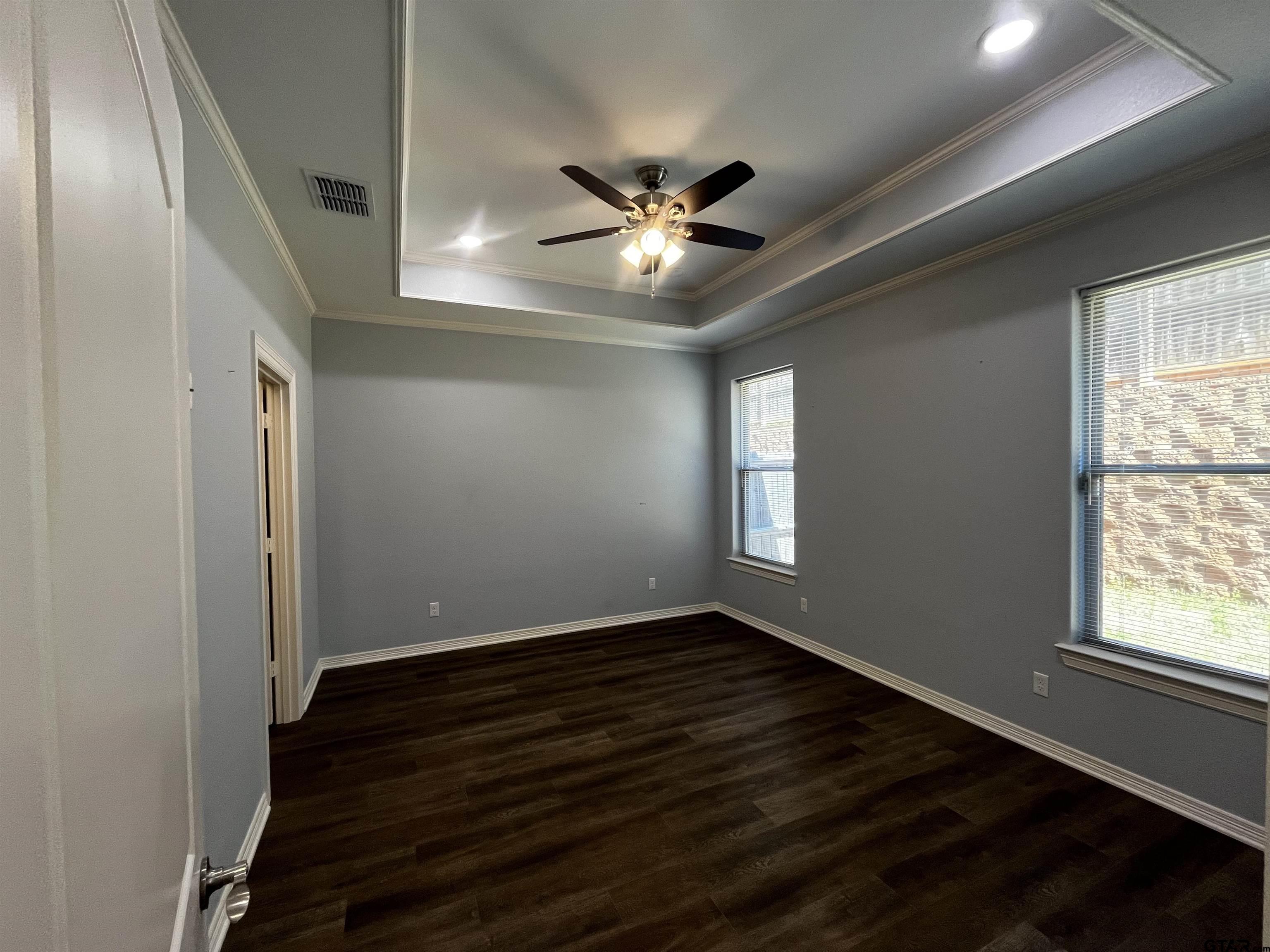 136 Letha Court Tyler, TX 75702 - Photo 12 of 34 a view of an empty room with wooden floor and a window