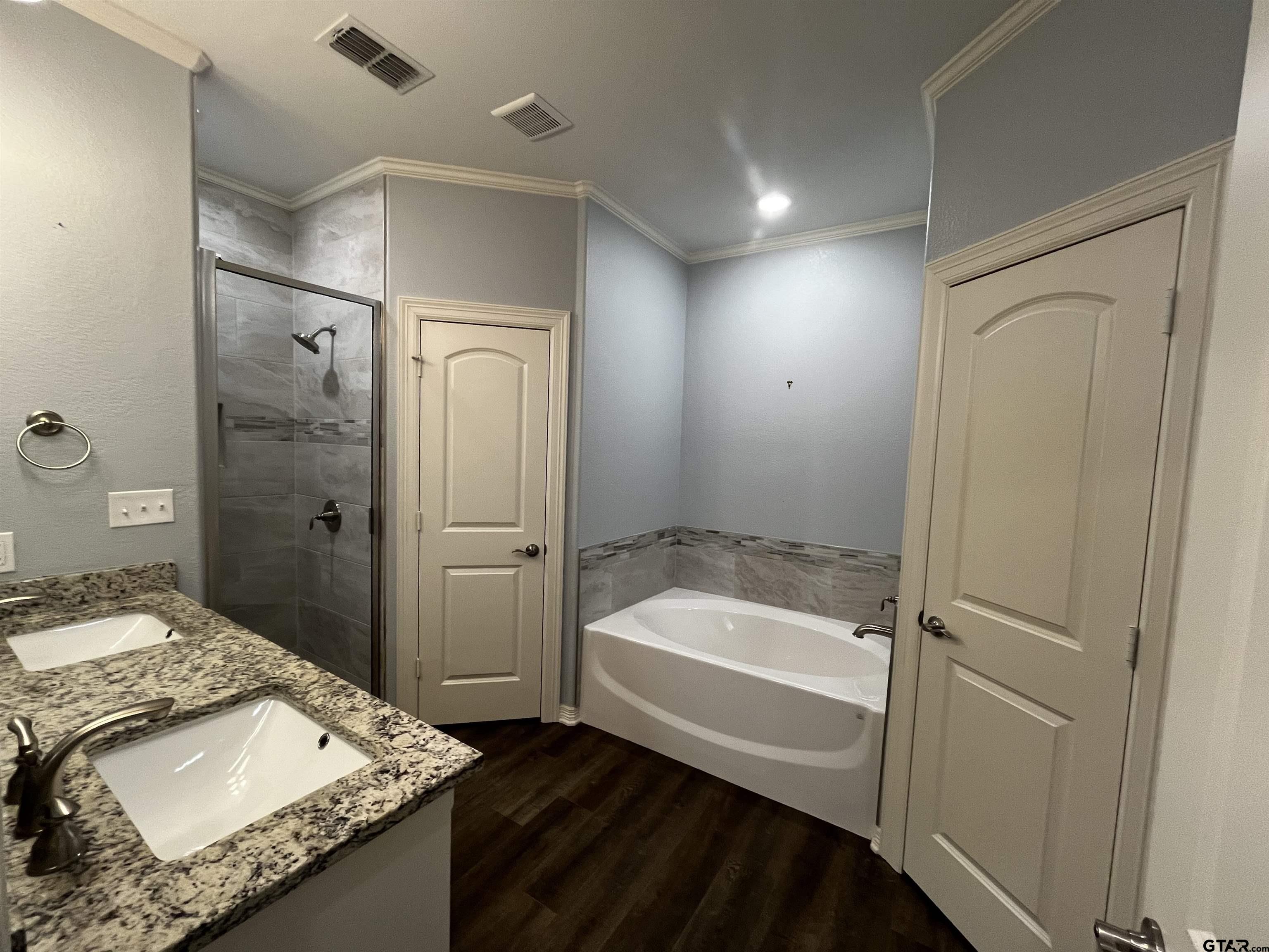 136 Letha Court Tyler, TX 75702 - Photo 14 of 34 a bathroom with a granite countertop sink a toilet and shower