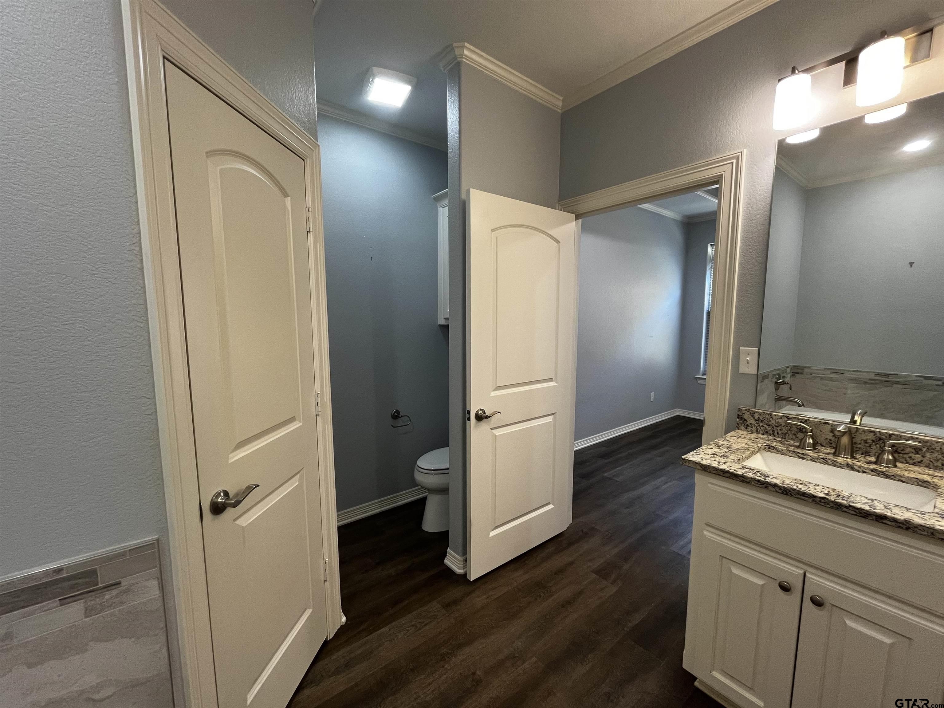 136 Letha Court Tyler, TX 75702 - Photo 17 of 34 a bathroom with a sink and a mirror