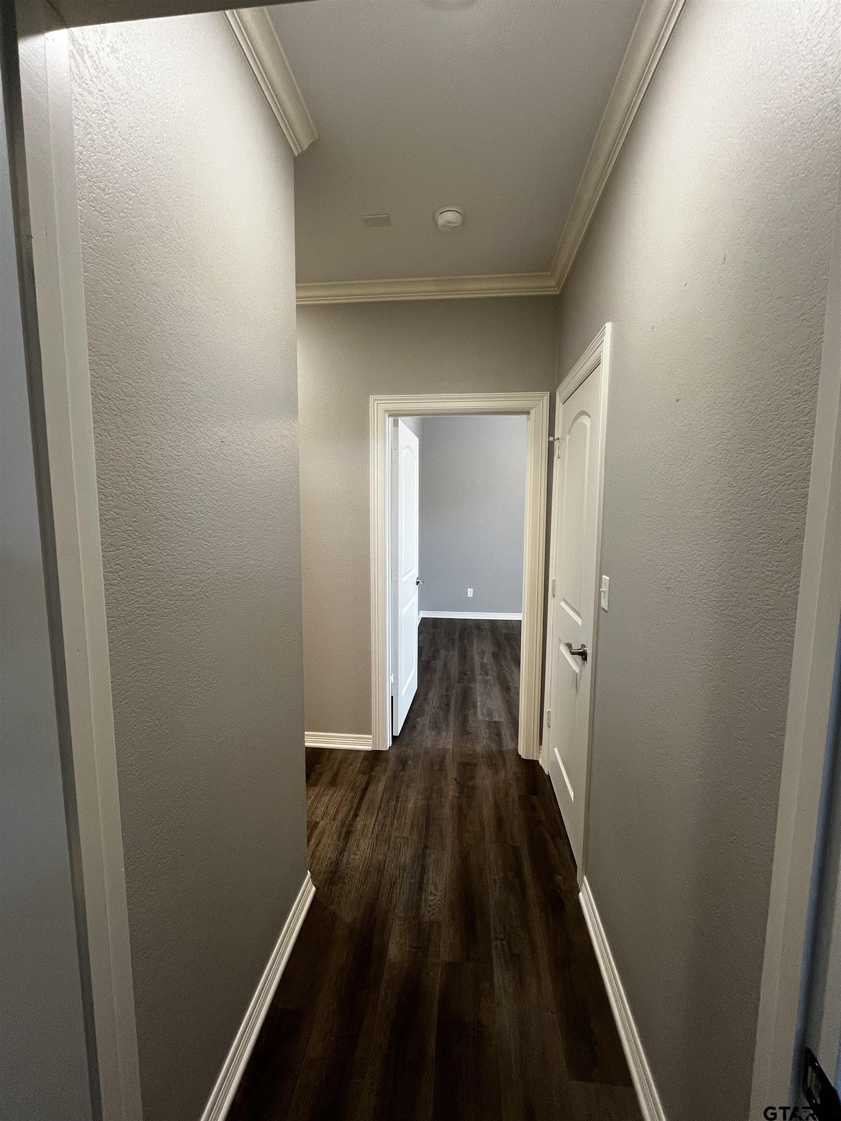 136 Letha Court Tyler, TX 75702 - Photo 20 of 34 a view of a hallway with wooden floor