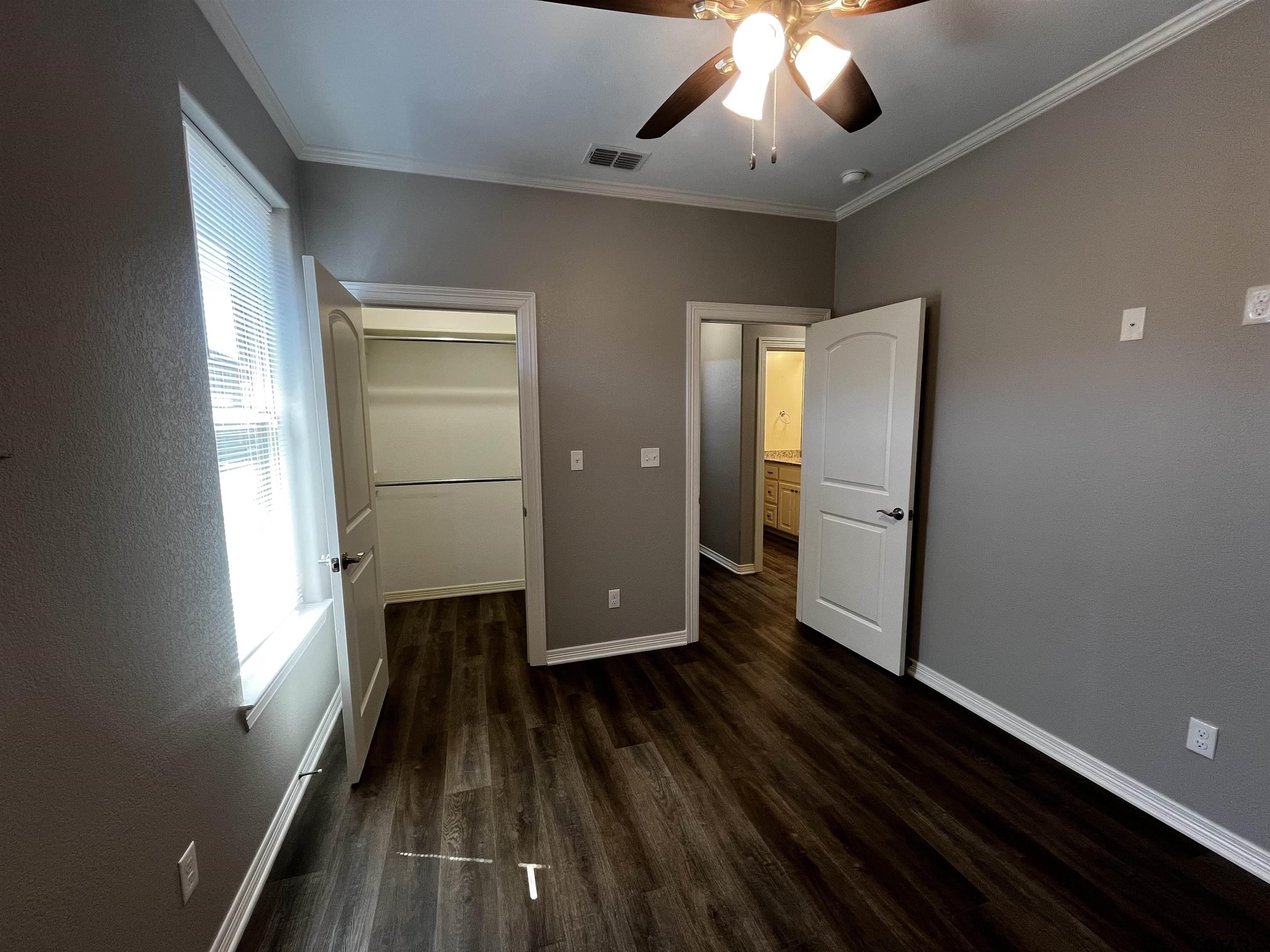 136 Letha Court Tyler, TX 75702 - Photo 22 of 34 wooden floor in an empty room with a window